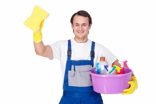 Professional cleaner handling garments at Aldwych Cleaners