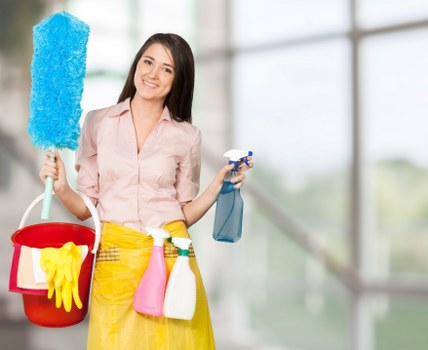 Professional window cleaner using specialized equipment